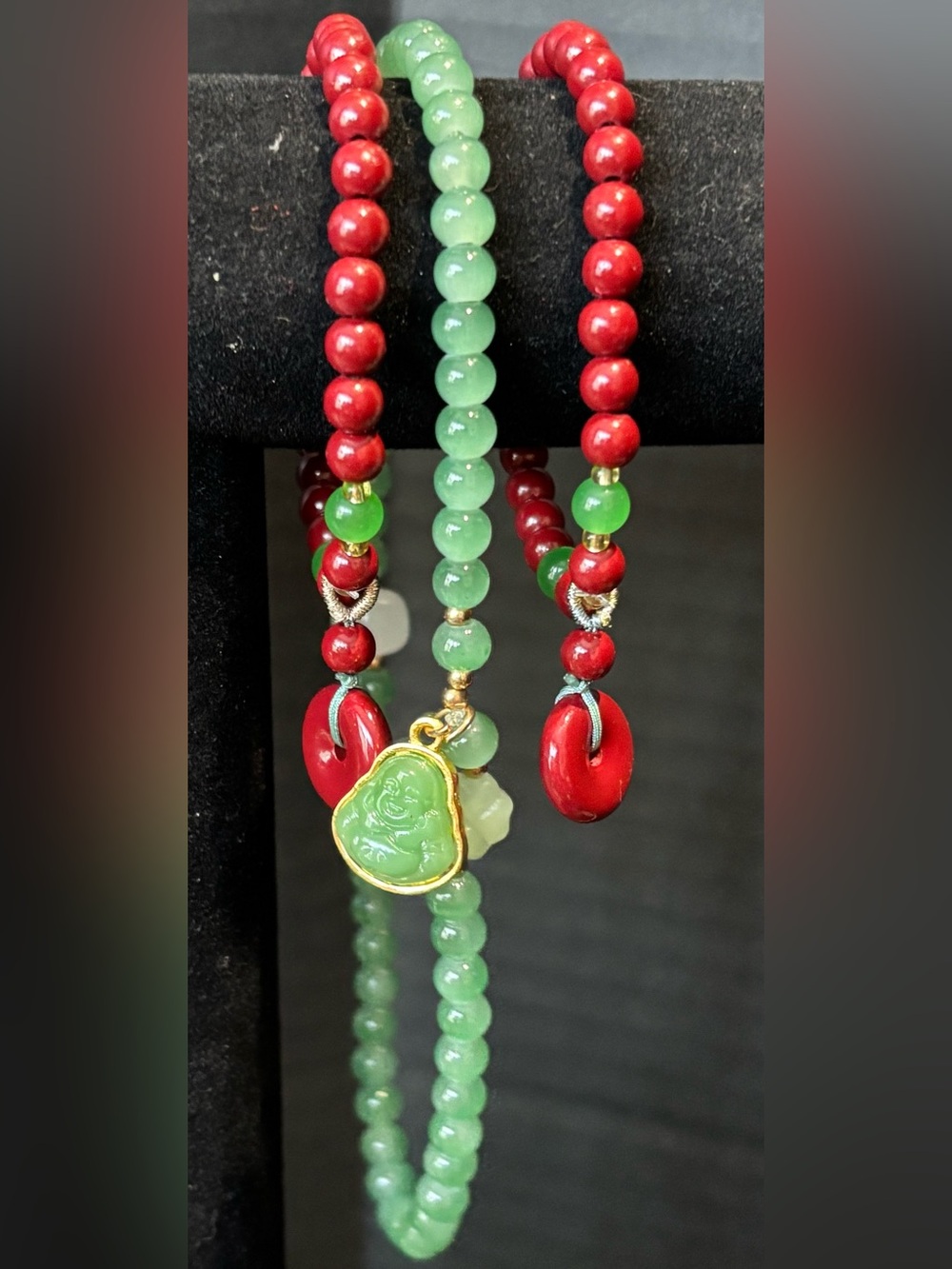 Jade Like Buddha Pendant Necklace with Red Coral Like Bead Accents & Peace Charm